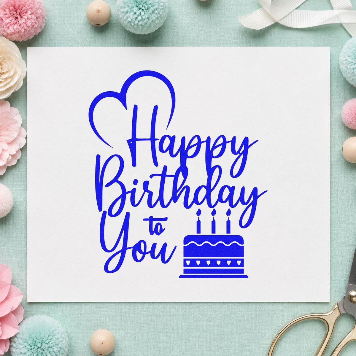 Birthday To You Cake craft stamp imprinted in blue ink on paper, a design suited to framed packing room.