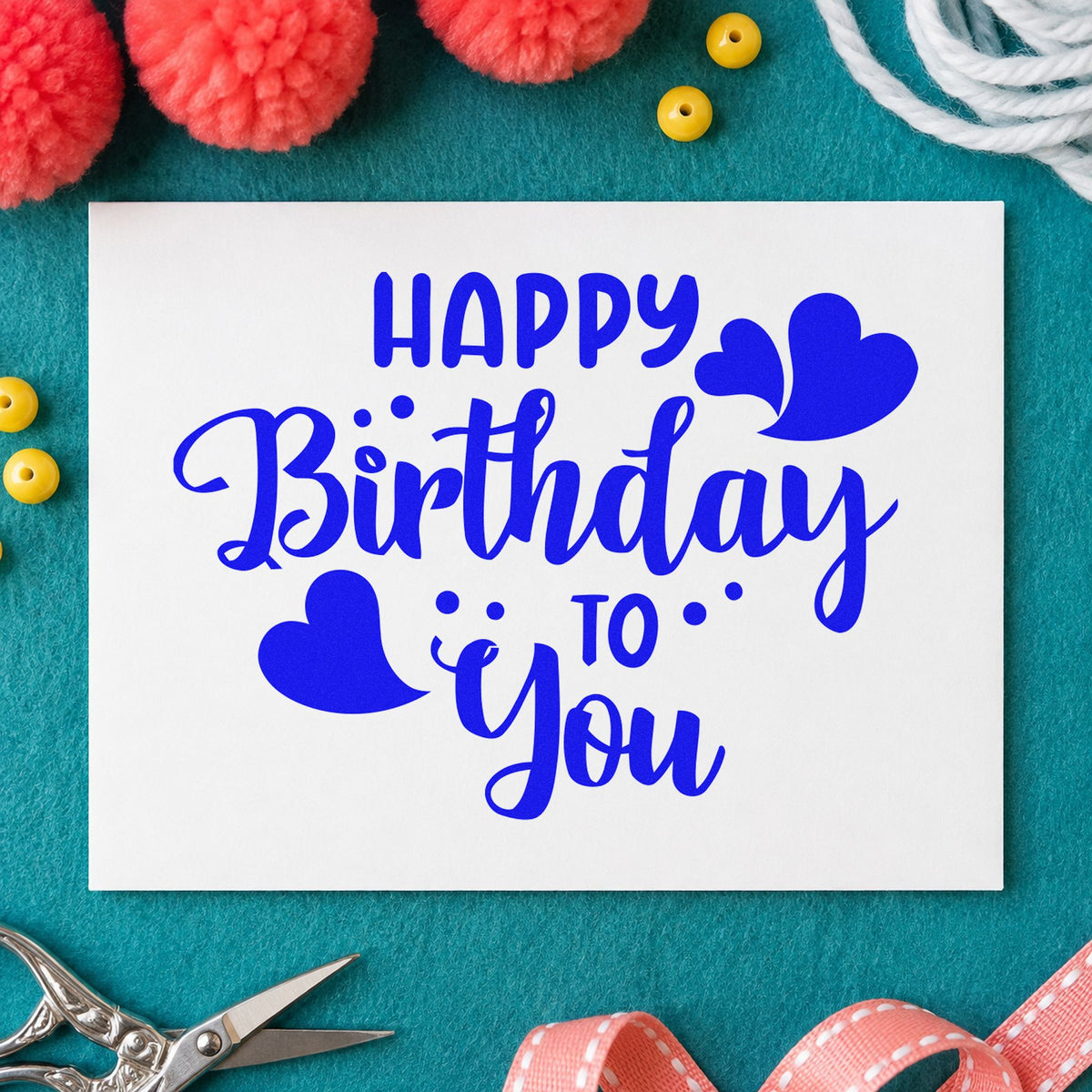 Happy Birthday To You craft stamp in blue ink on cardstock, an easy option for two towel printing.