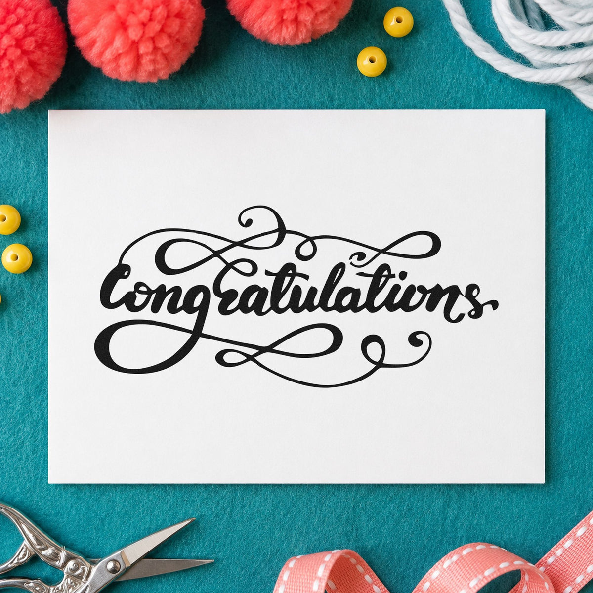 Congratulations Ornate Flourishes craft stamp imprint in black ink on a handmade project, one idea being desk kit gift tags.