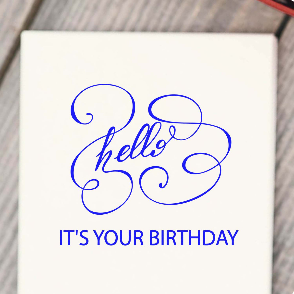 White birthday stamp seal with blue ornate hello script and ITS YOUR BIRTHDAY text