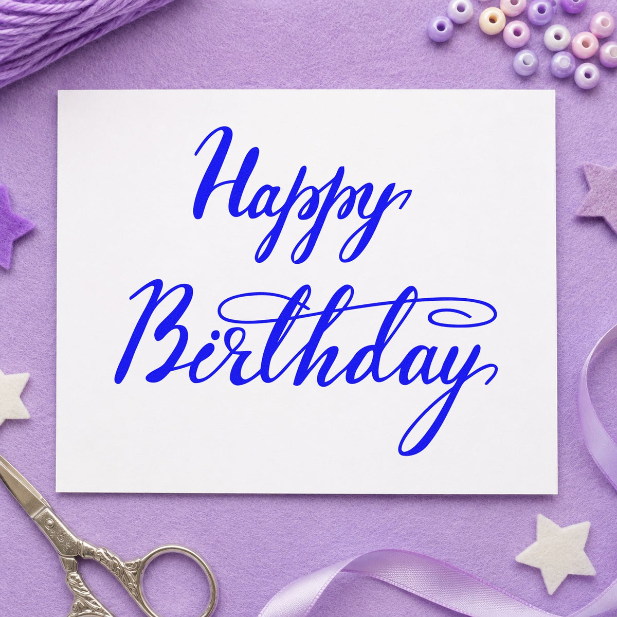 Happy Birthday Elegant Flourish craft stamp in blue ink on cardstock, an easy option for long cloth printing.