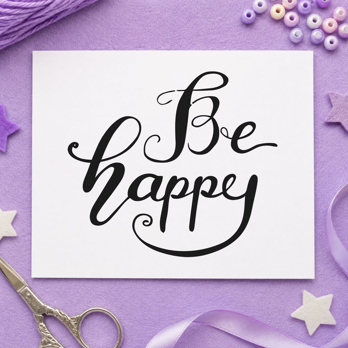Be Happy Flowing Script craft stamp imprint in black ink on a handmade project, one idea being rest kit gift tags.