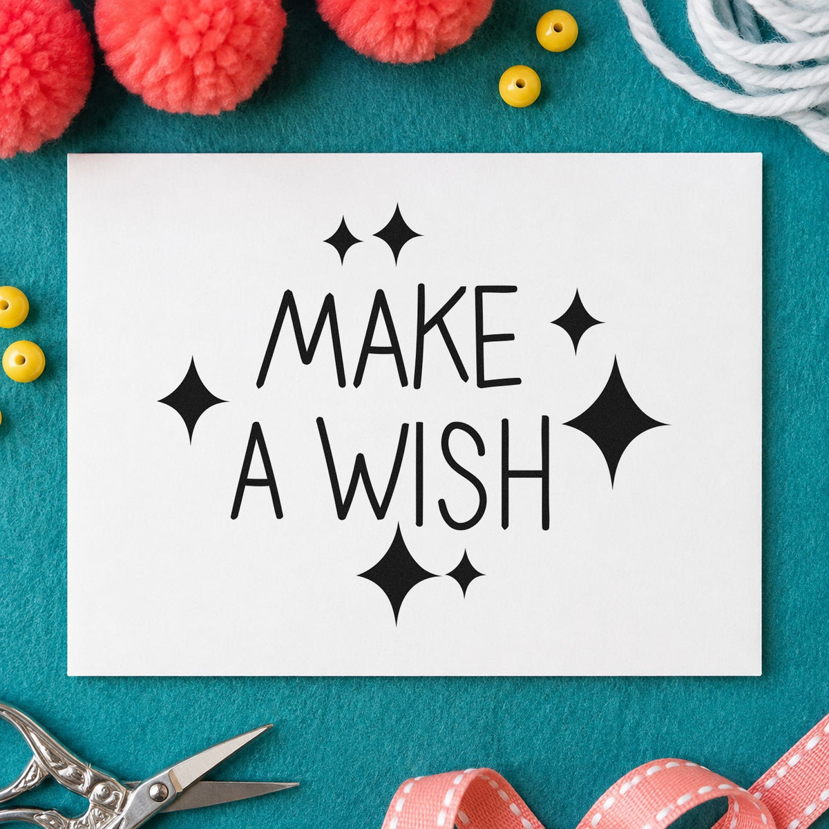 Make A Wish Sparkles craft stamp imprint in black ink on a handmade project, one idea being bedside gift tags.