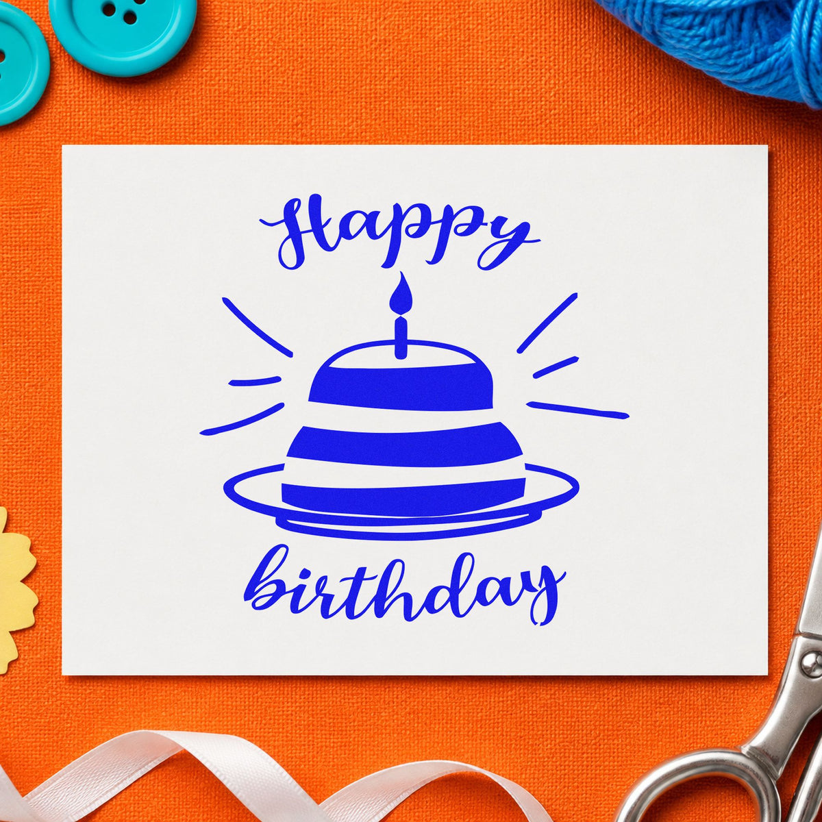 Happy Birthday Cake Rays craft stamp imprinted in blue ink on paper, a design suited to framed nursery wall.