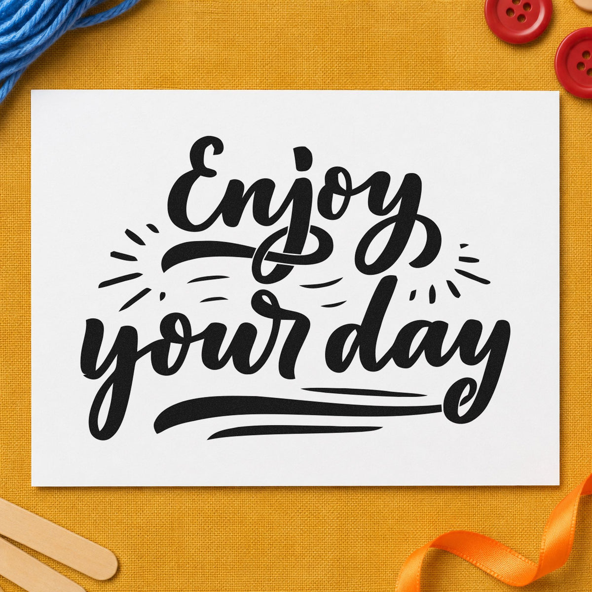 Enjoy Your Day Script craft stamp imprint in black ink on a handmade project, one idea being desk treat gift tags.