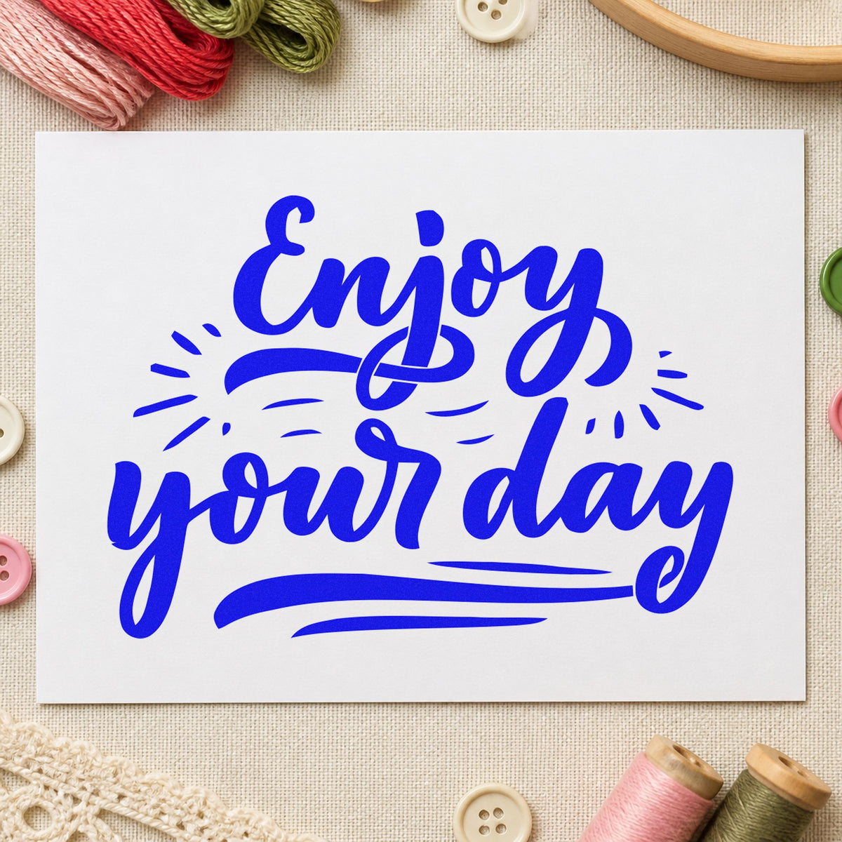 Enjoy Your Day Script craft stamp imprinted in blue ink on paper, a design suited to framed office corner.