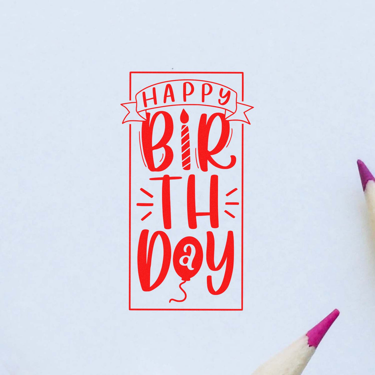 Red Happy Birthday stamp seal in bright red on white paper, with playful lettering and pencil tips at the corners.