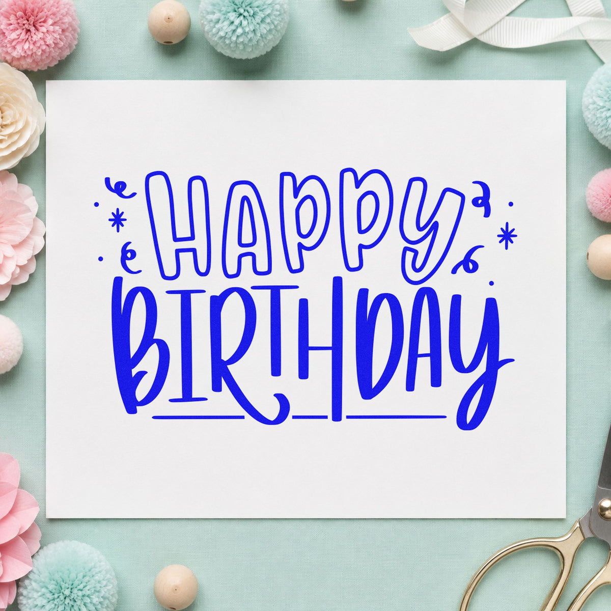 Outlined Happy Birthday Confetti craft stamp imprinted in blue ink on paper, a design suited to framed work desk.