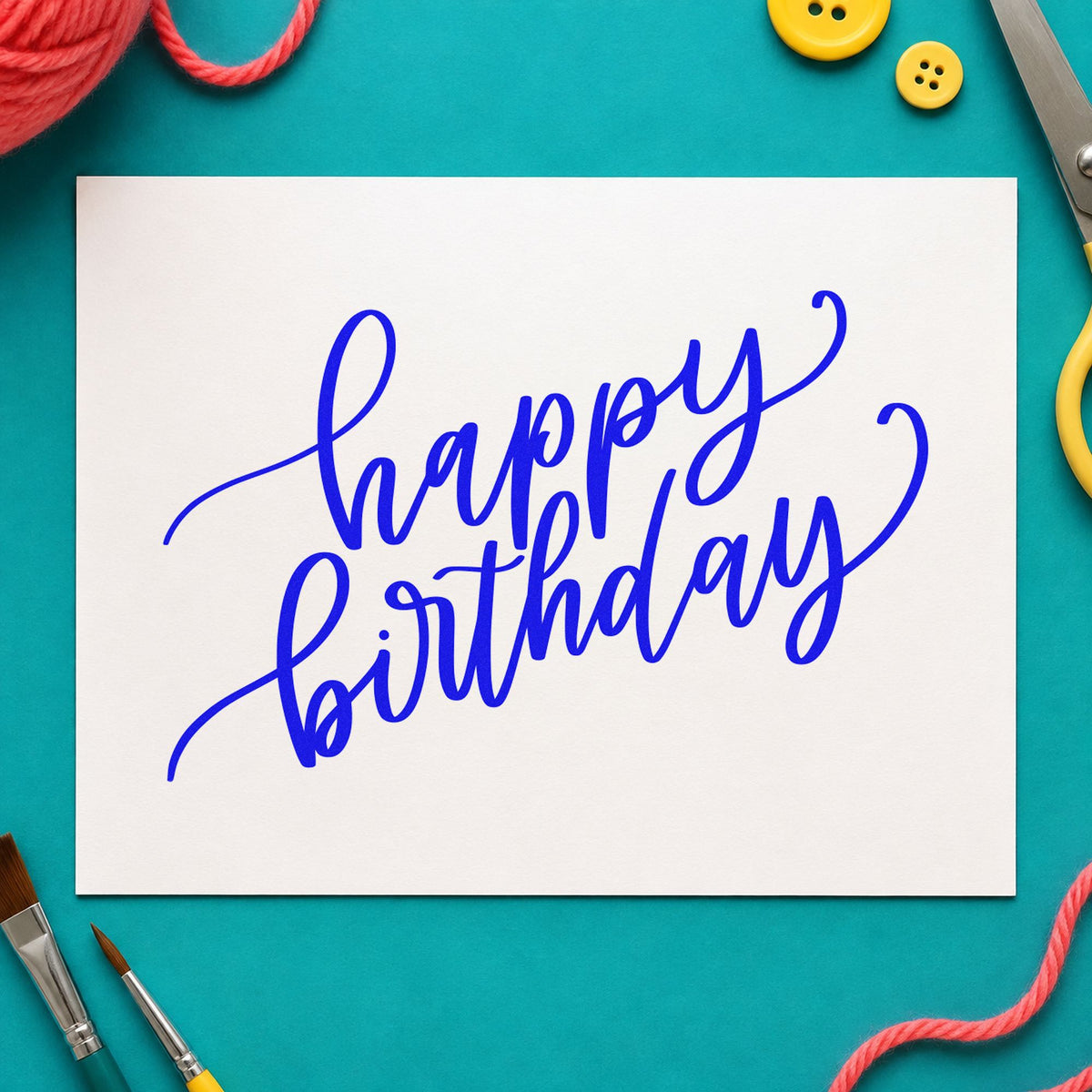 Happy Birthday Diagonal Script craft stamp in blue ink on cardstock, an easy option for break room printing.