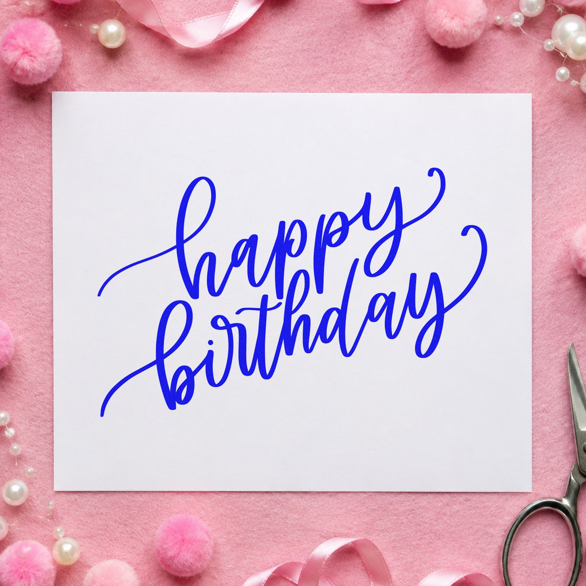 Happy Birthday Diagonal Script craft stamp imprinted in blue ink on paper, a design suited to framed break room.