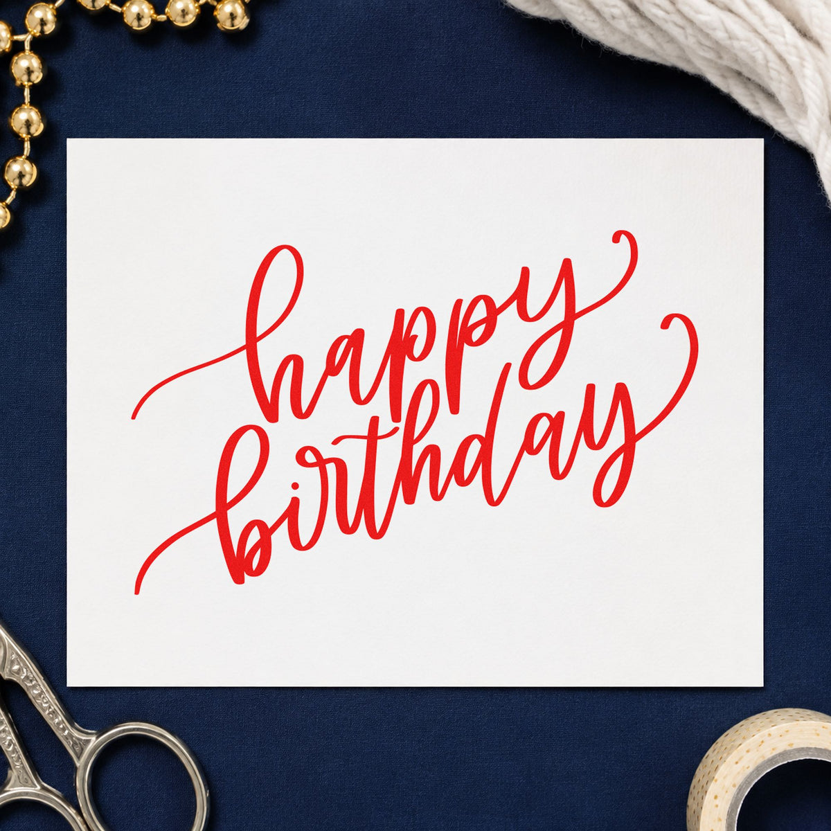 Happy Birthday Diagonal Script craft stamp imprint in red ink on a handmade project, one idea being group sign cards.