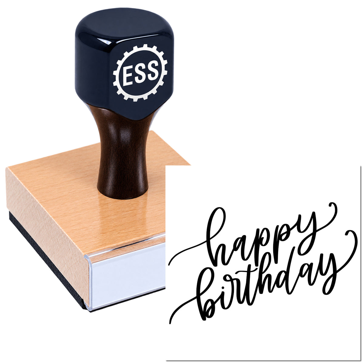 Black ESS rubber stamp on a copper seal block, stamping "happy birthday" in black script.