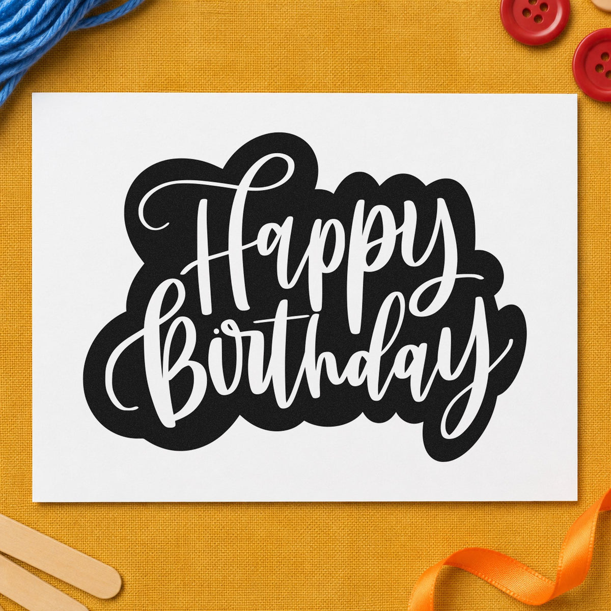Birthday White Script Silhouette craft stamp imprint in black ink on a handmade project, one idea being finished sign tags.