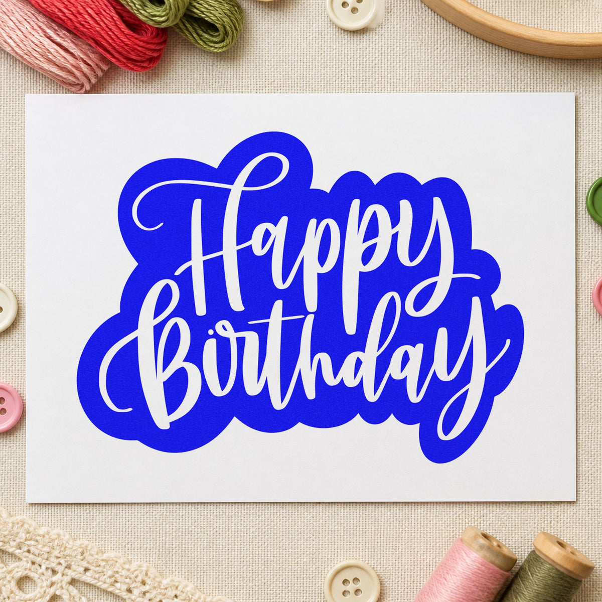Birthday White Script Silhouette craft stamp imprinted in blue ink on paper, a design suited to framed work shop.