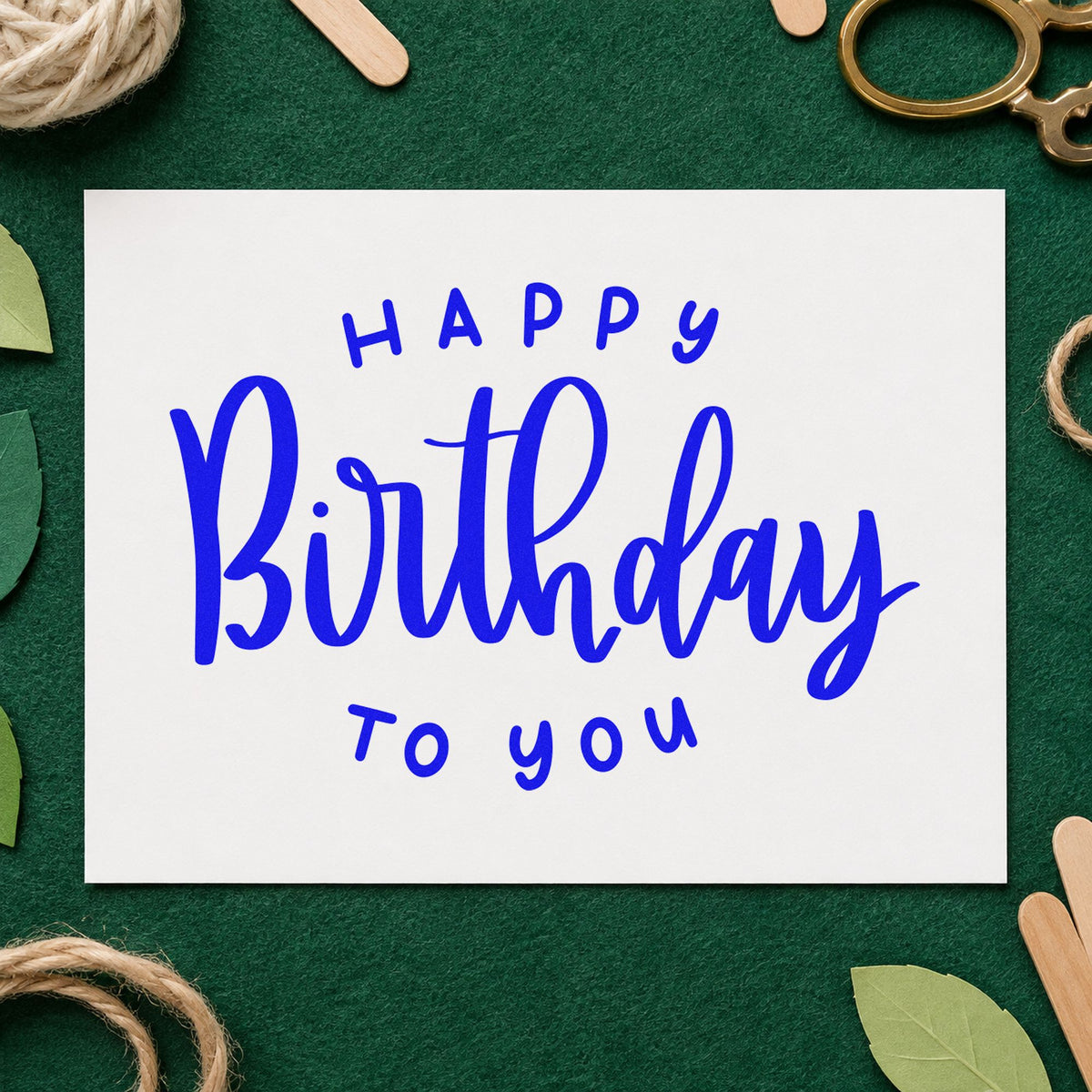 Happy Birthday To You craft stamp imprinted in blue ink on paper, a design suited to framed green room.