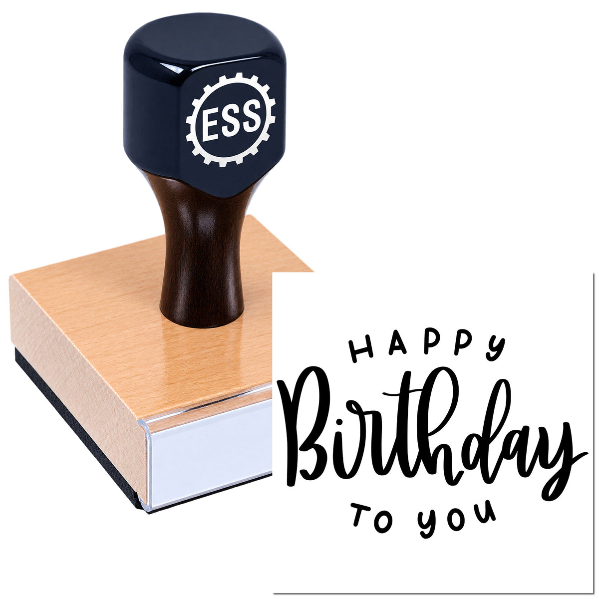 Dark navy ESS gear stamp on a copper-toned wooden base, with a Happy Birthday seal in black script.
