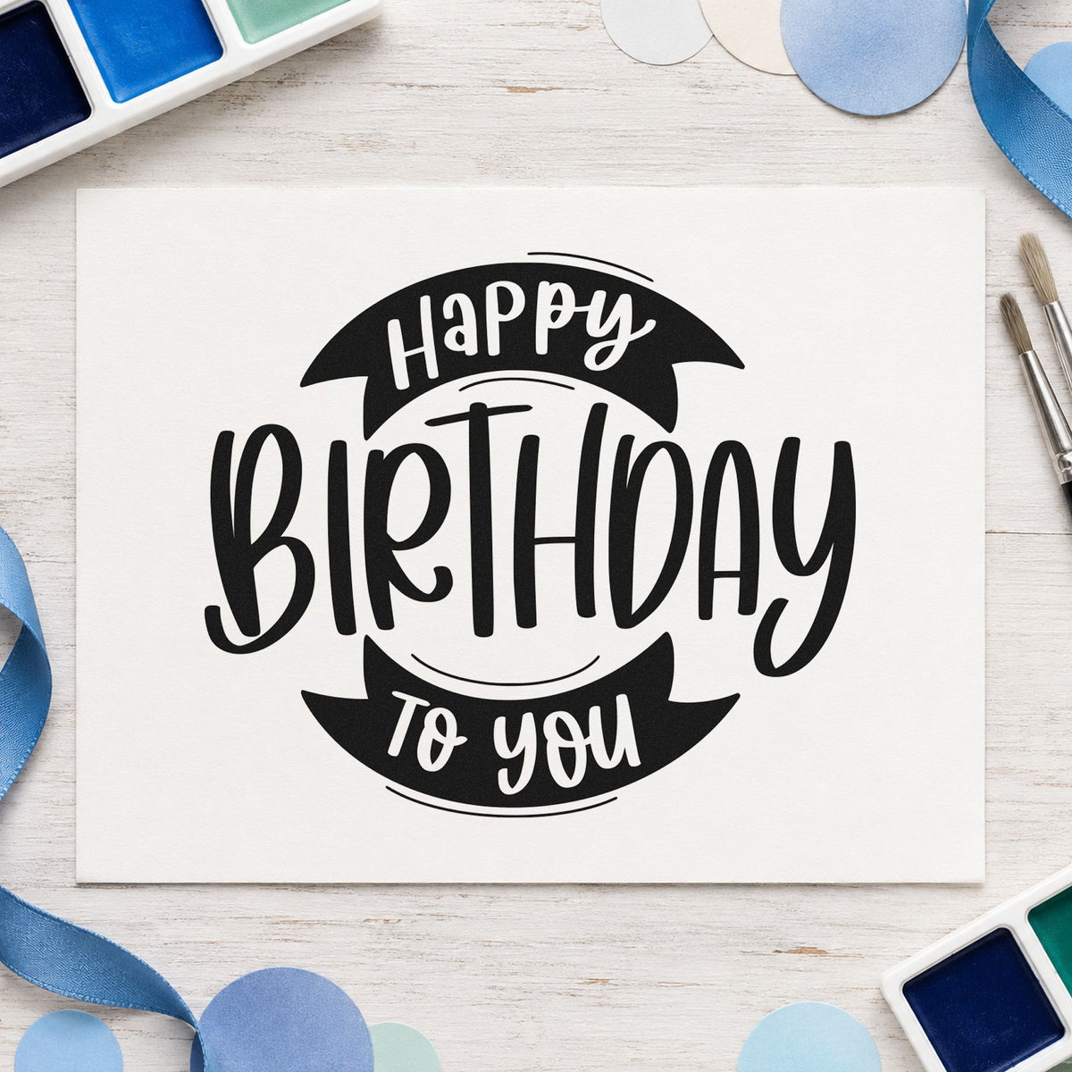 Birthday To You Ribbon craft stamp imprint in black ink on a handmade project, one idea being picnic box gift tags.