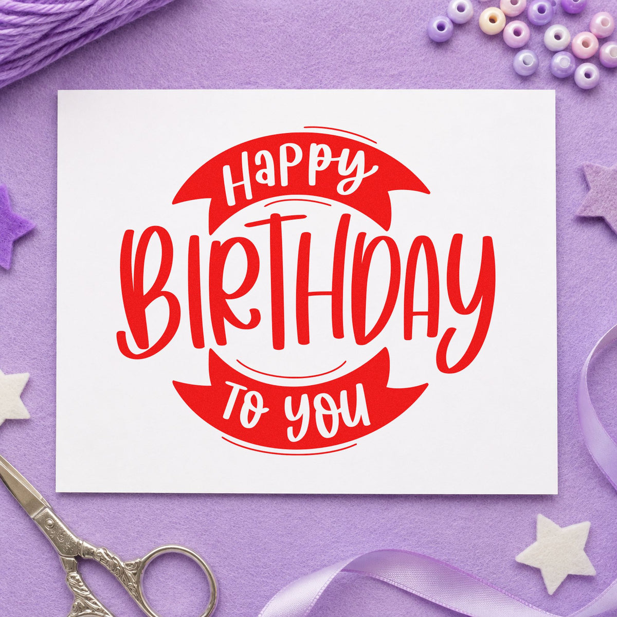 Birthday To You Ribbon rubber stamp shown in red ink, stamped for projects such as bin travel labels.