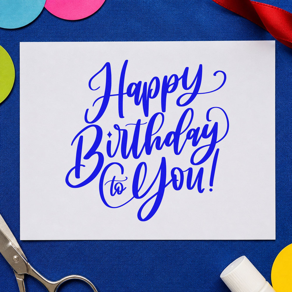 Happy Birthday To You craft stamp in blue ink on cardstock, an easy option for bed runner printing.