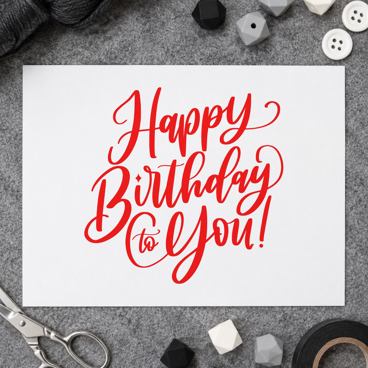 Happy Birthday To You rubber stamp shown in red ink, stamped for projects such as bin amenity labels.