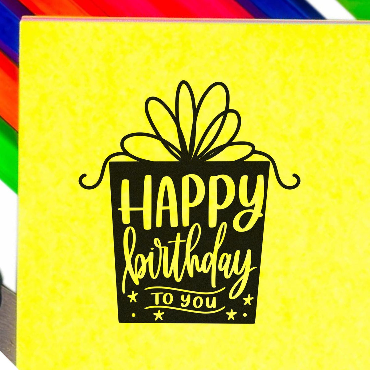 Black Happy Birthday gift stamp on bright yellow seal with rainbow border