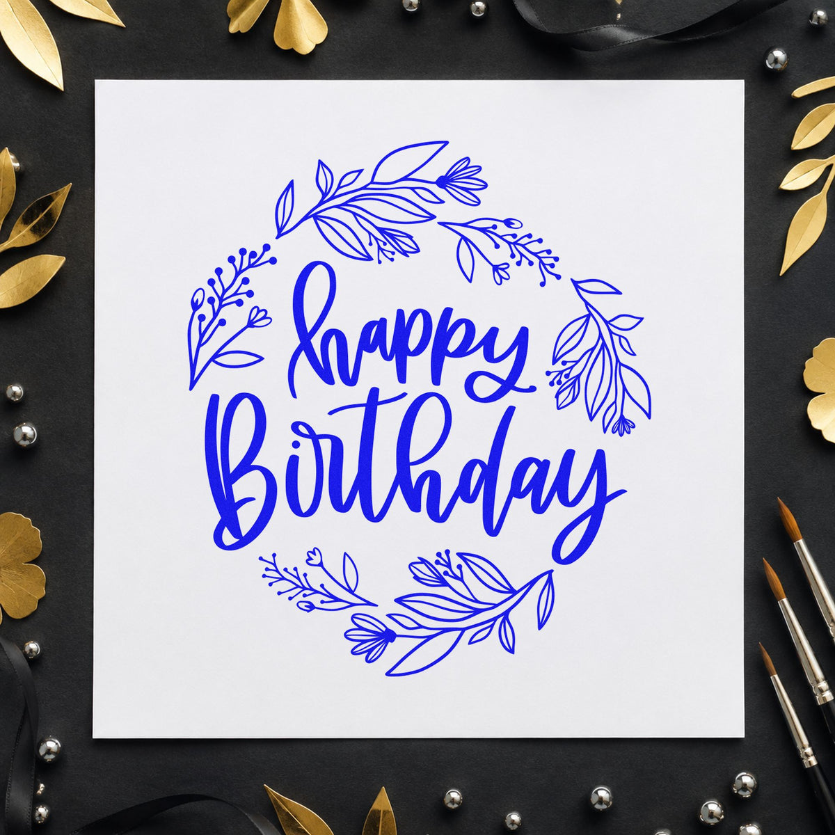 Happy Birthday Leafy Wreath craft stamp imprinted in blue ink on paper, a design suited to framed studio entry.