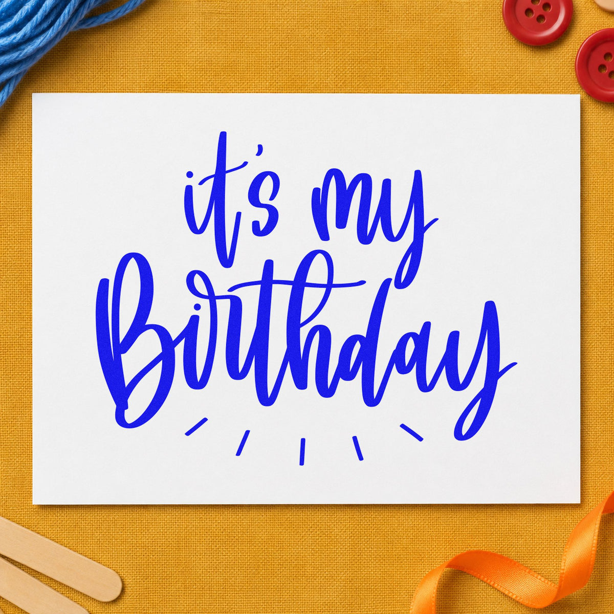 My Birthday Radiating Script craft stamp in blue ink on cardstock, an easy option for shopping tote printing.
