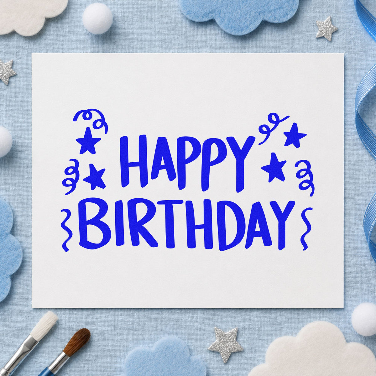 Birthday Stars And Streamers craft stamp in blue ink on cardstock, an easy option for picnic cloth printing.
