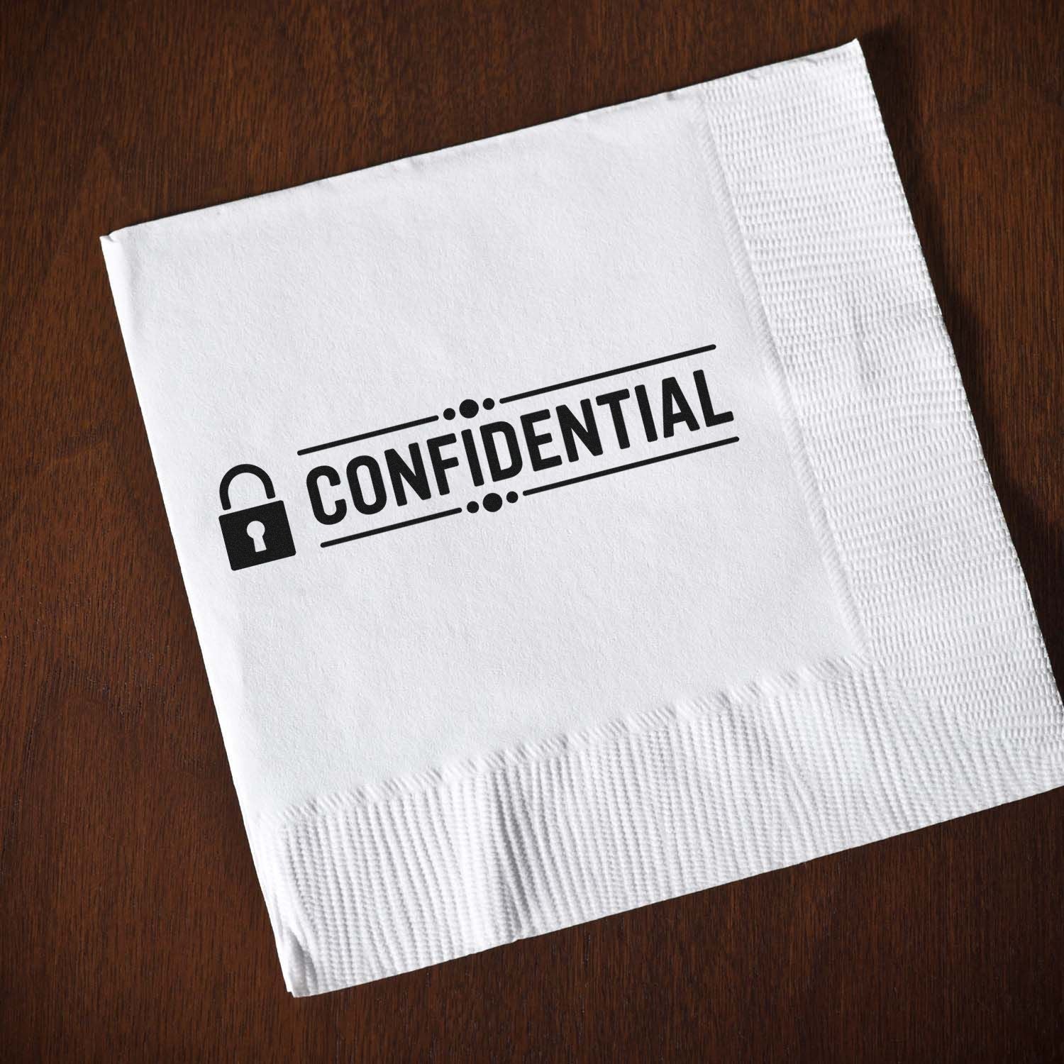 White napkin with black confidential stamp seal and padlock on dark wood background.