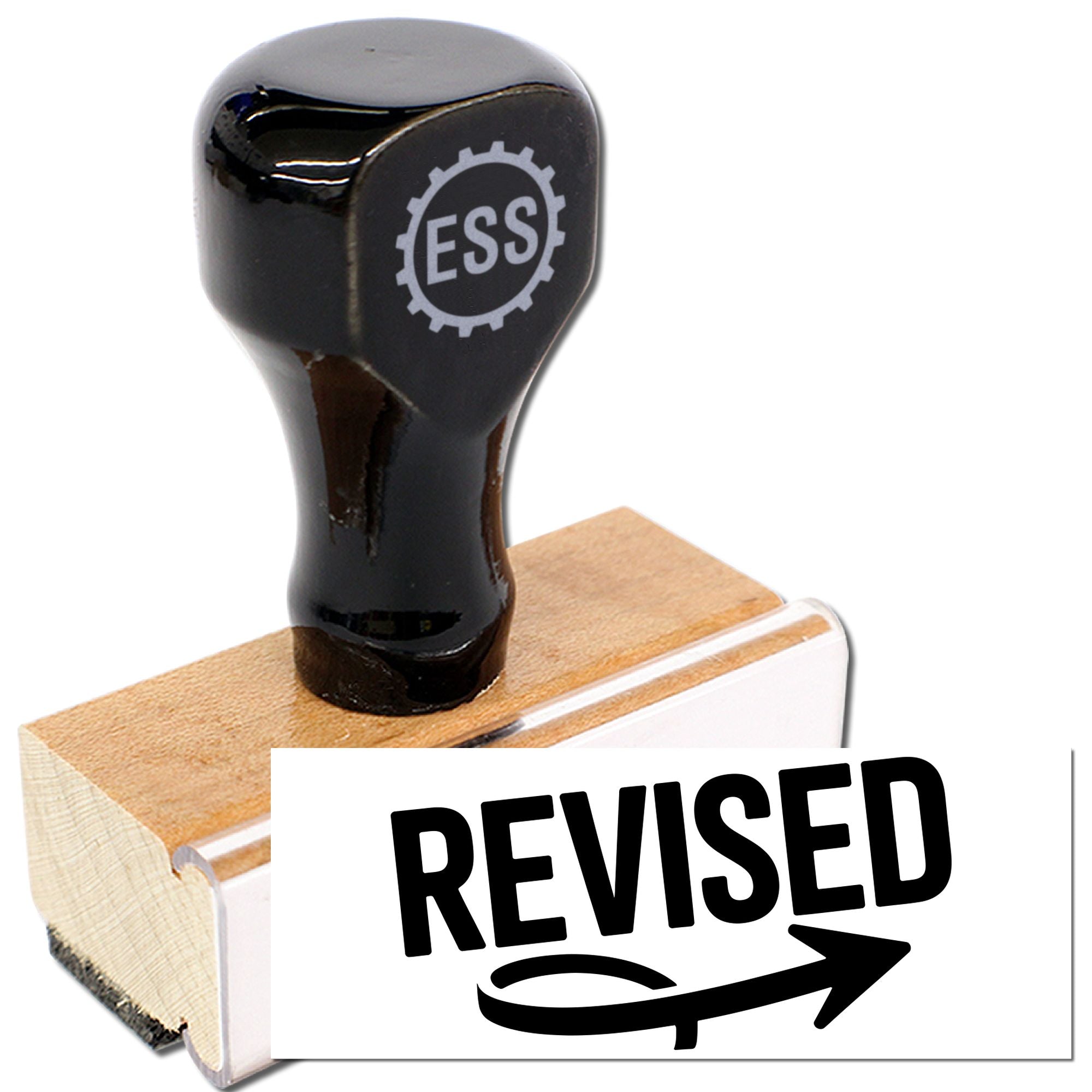 Black rubber stamp and seal on a wooden base, marked REVISED in bold black.