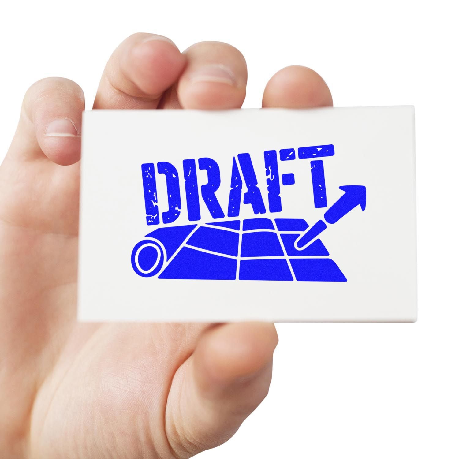 Hand holding white rubber stamp seal with blue DRAFT over rolled blueprint and arrow