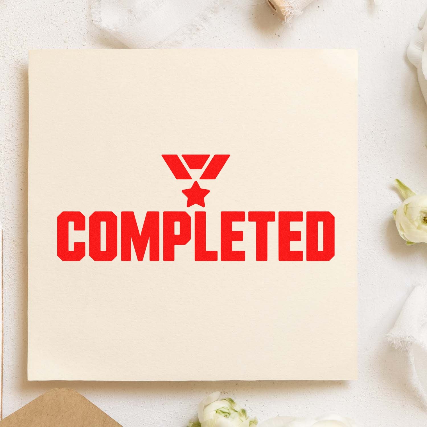 Cream paper card with bright red COMPLETED stamp and star seal icon, featuring a bold rubber-stamp style design.
