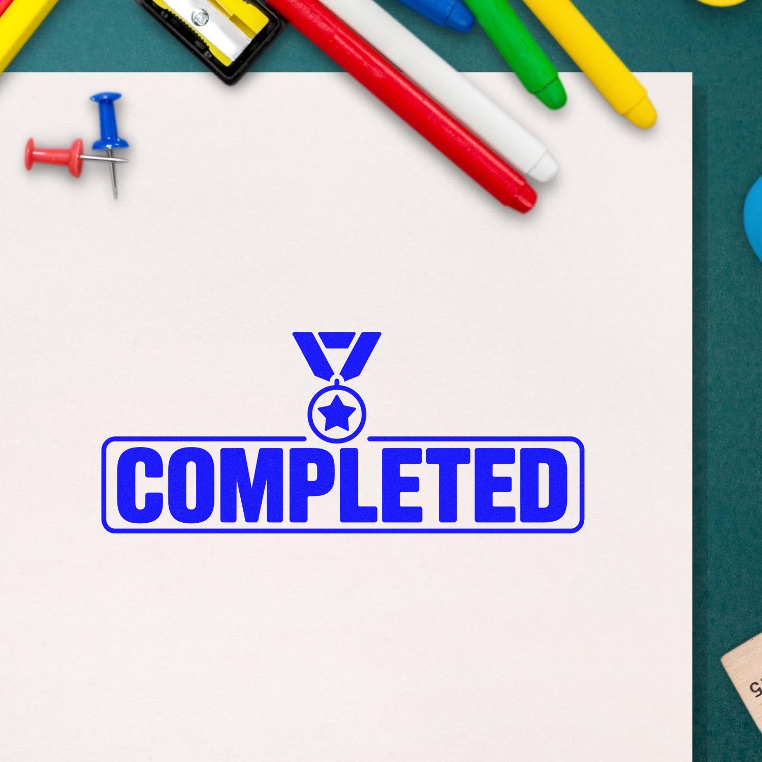 Blue COMPLETED stamp seal with medal icon on white paper, surrounded by colorful markers.