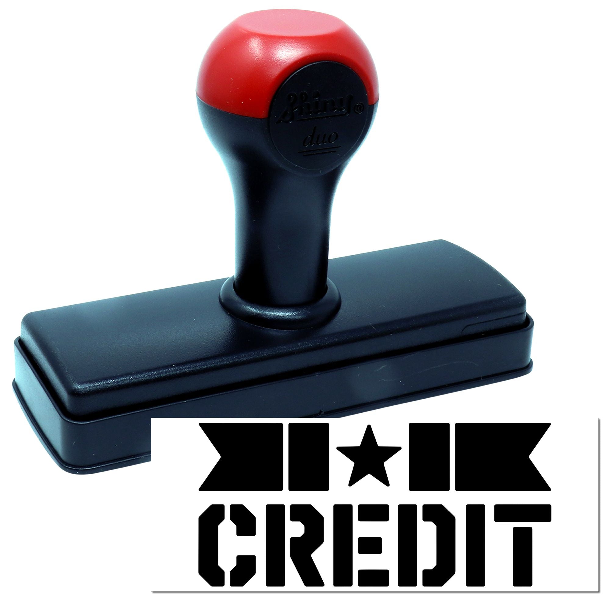 Red-and-black self-inking stamp with rectangular base and KREDIT seal imprint.