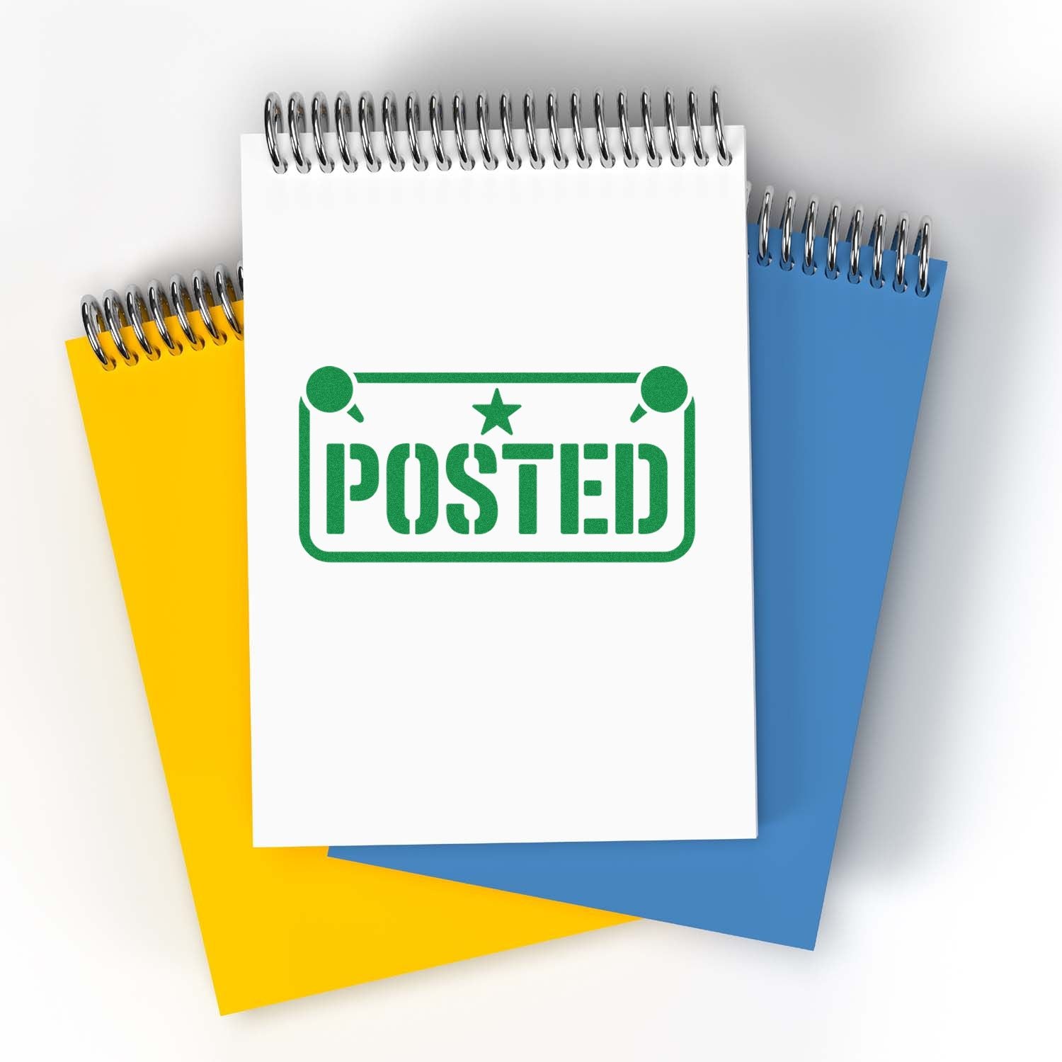 Spiral notepads in white, yellow and blue with a green POSTED stamp seal on the front cover.