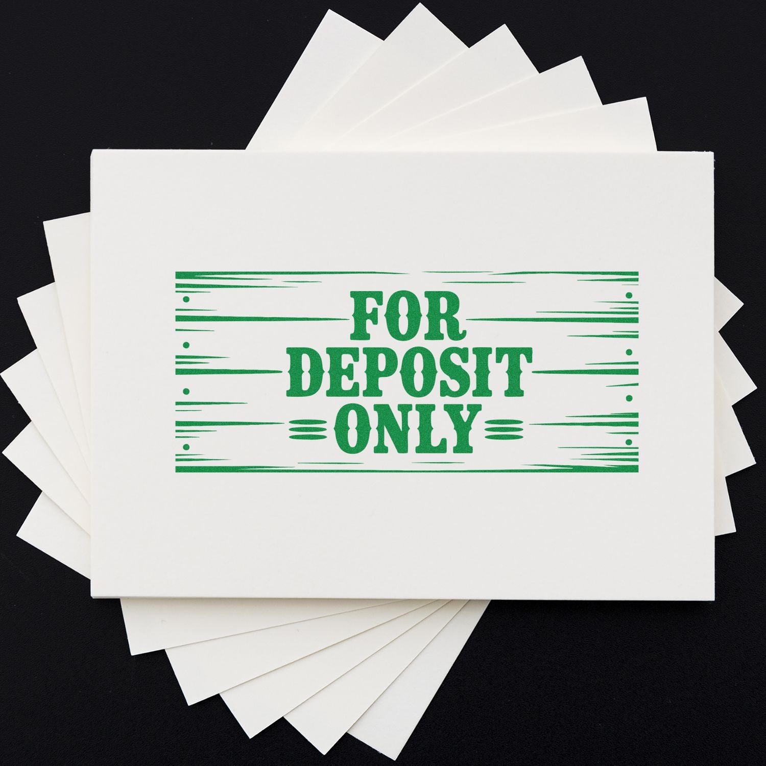Green FOR DEPOSIT ONLY stamp on stacked white envelopes, showing bank deposit seal products.
