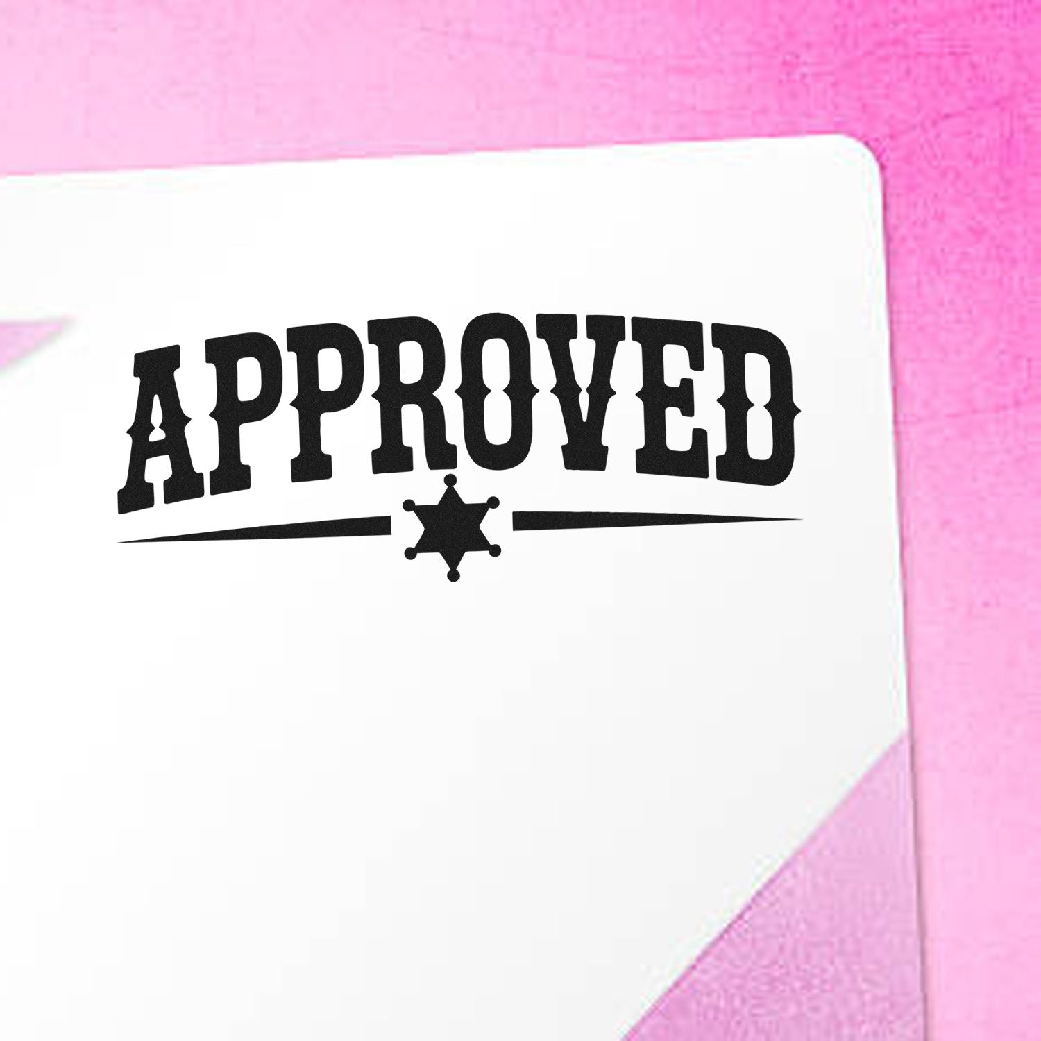Black APPROVED stamp seal on white paper, set against a pink background.