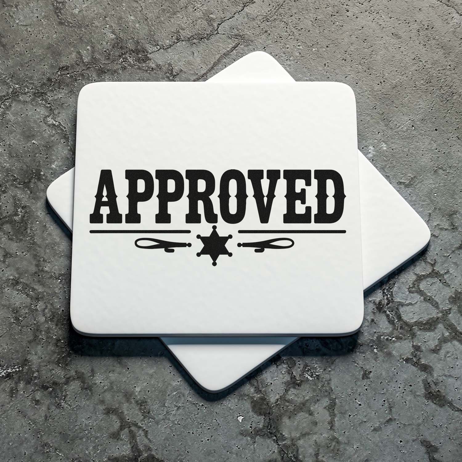 White rubber stamp and seal with bold black APPROVED text and sheriff-star icon on textured gray background.