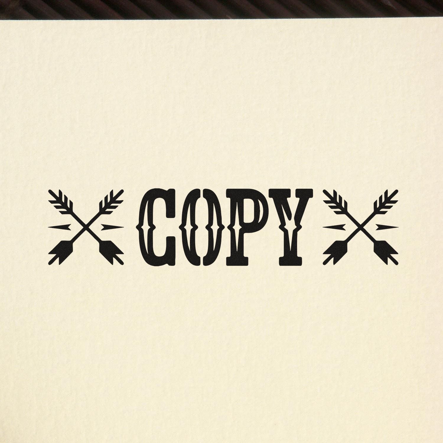 Black COPY stamp and seal with crossed arrows on cream background