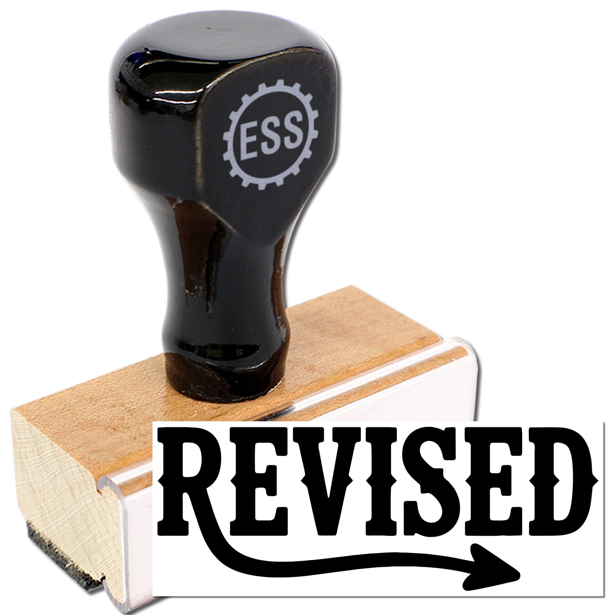 Black ESS rubber stamp on wooden base, with white seal block and bold black REVISED text