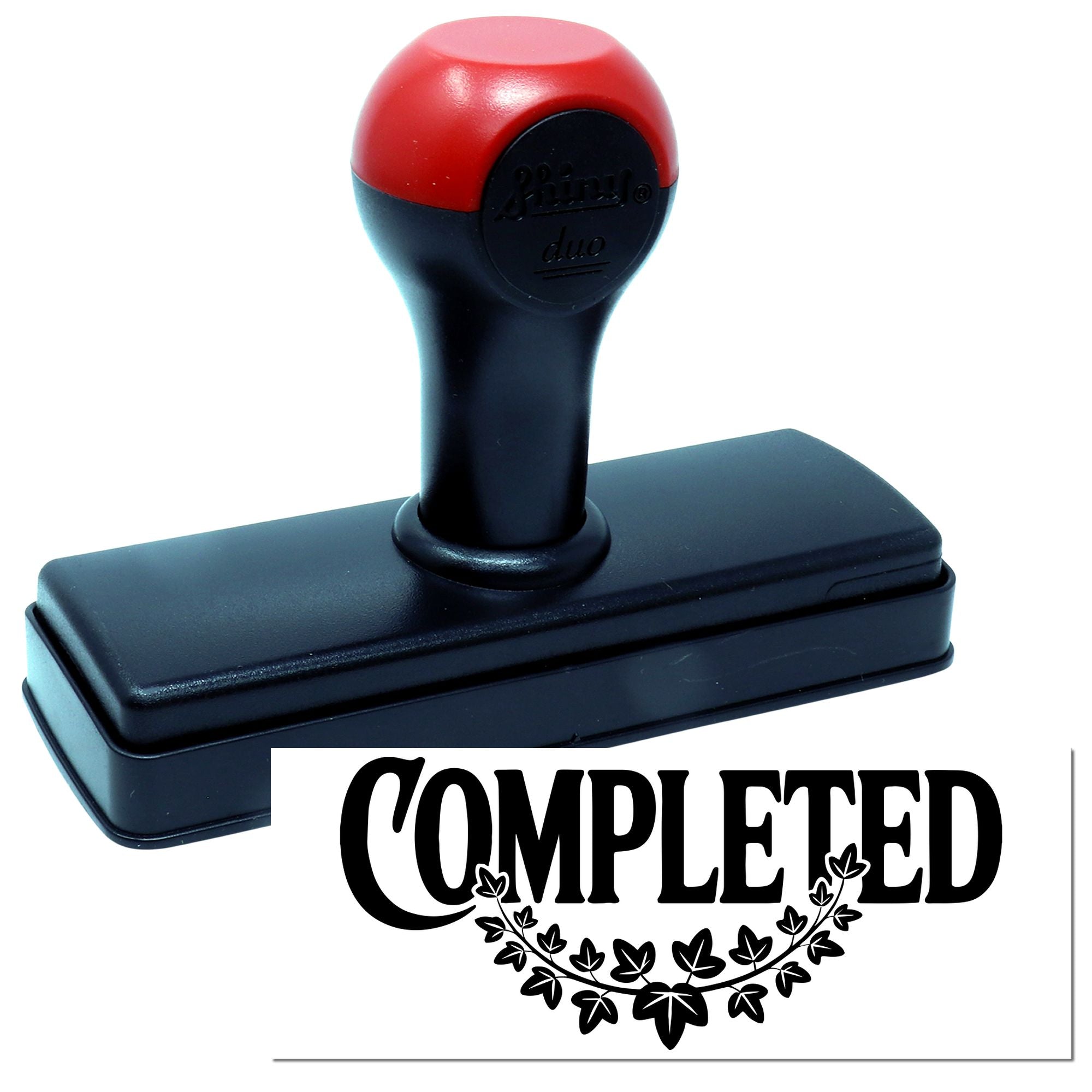 Red and black self-inking stamp with COMPLETED seal impression and leaf wreath design.