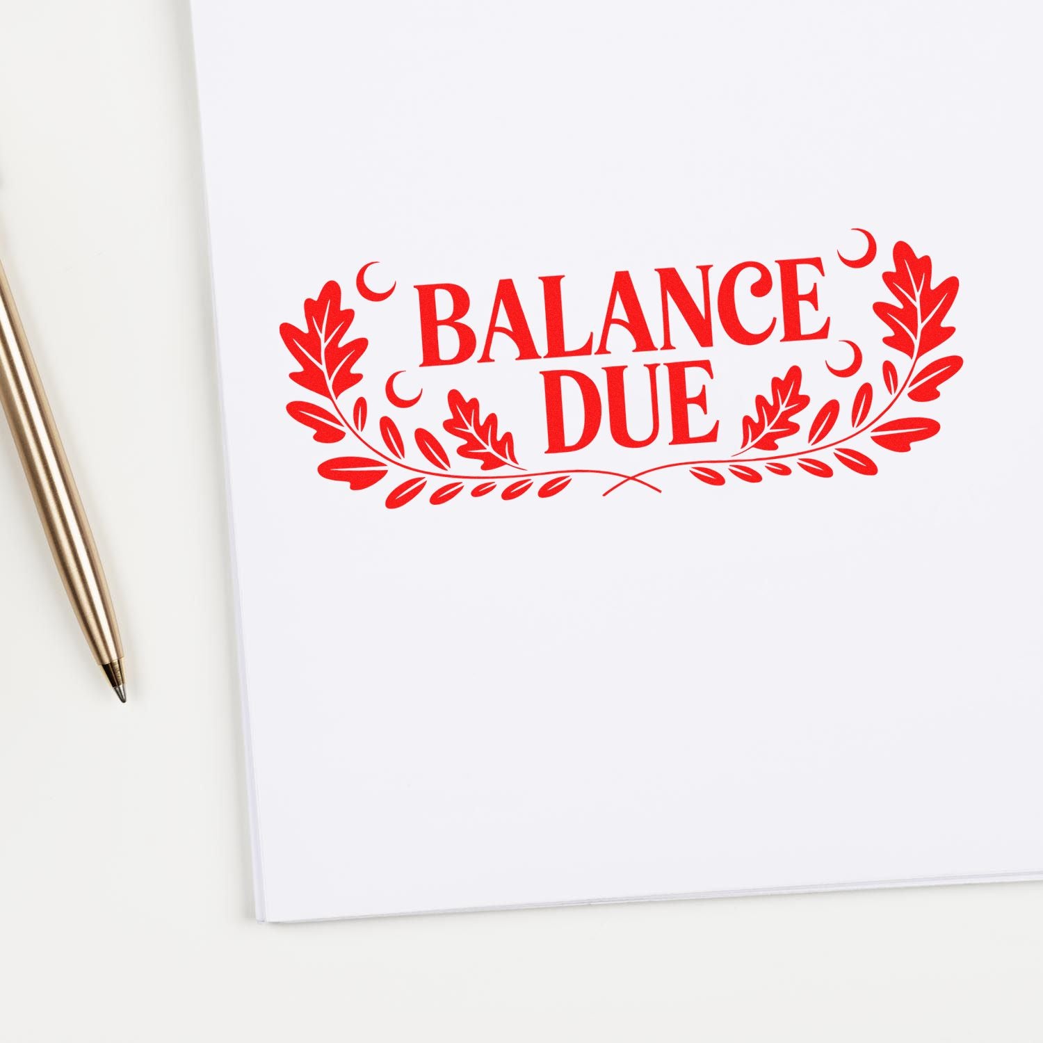 Red Balance Due decorative stamp and seal with laurel leaves and crescent accents on white paper