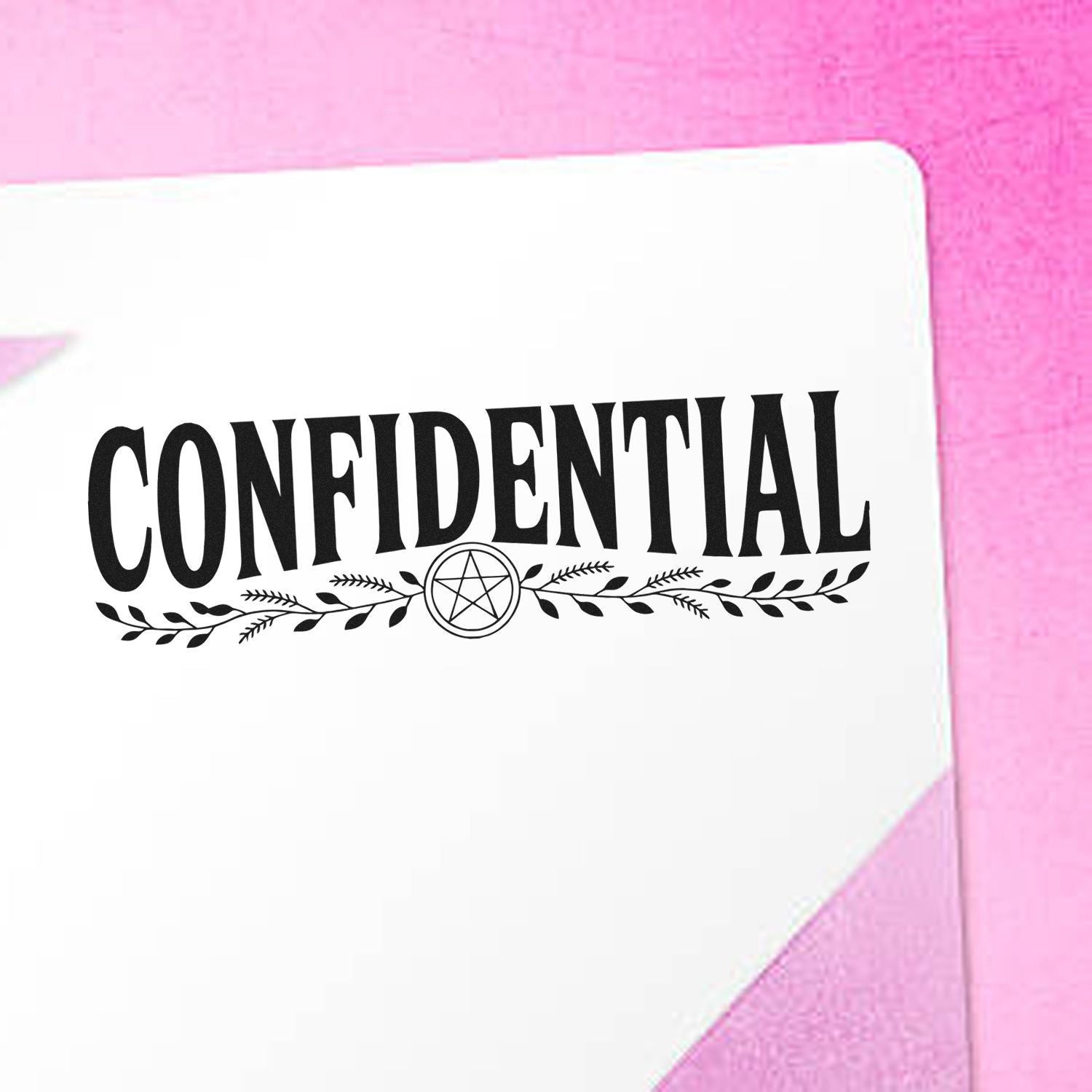White confidential stamp and seal design with black text and decorative wreath emblem on a pink background.