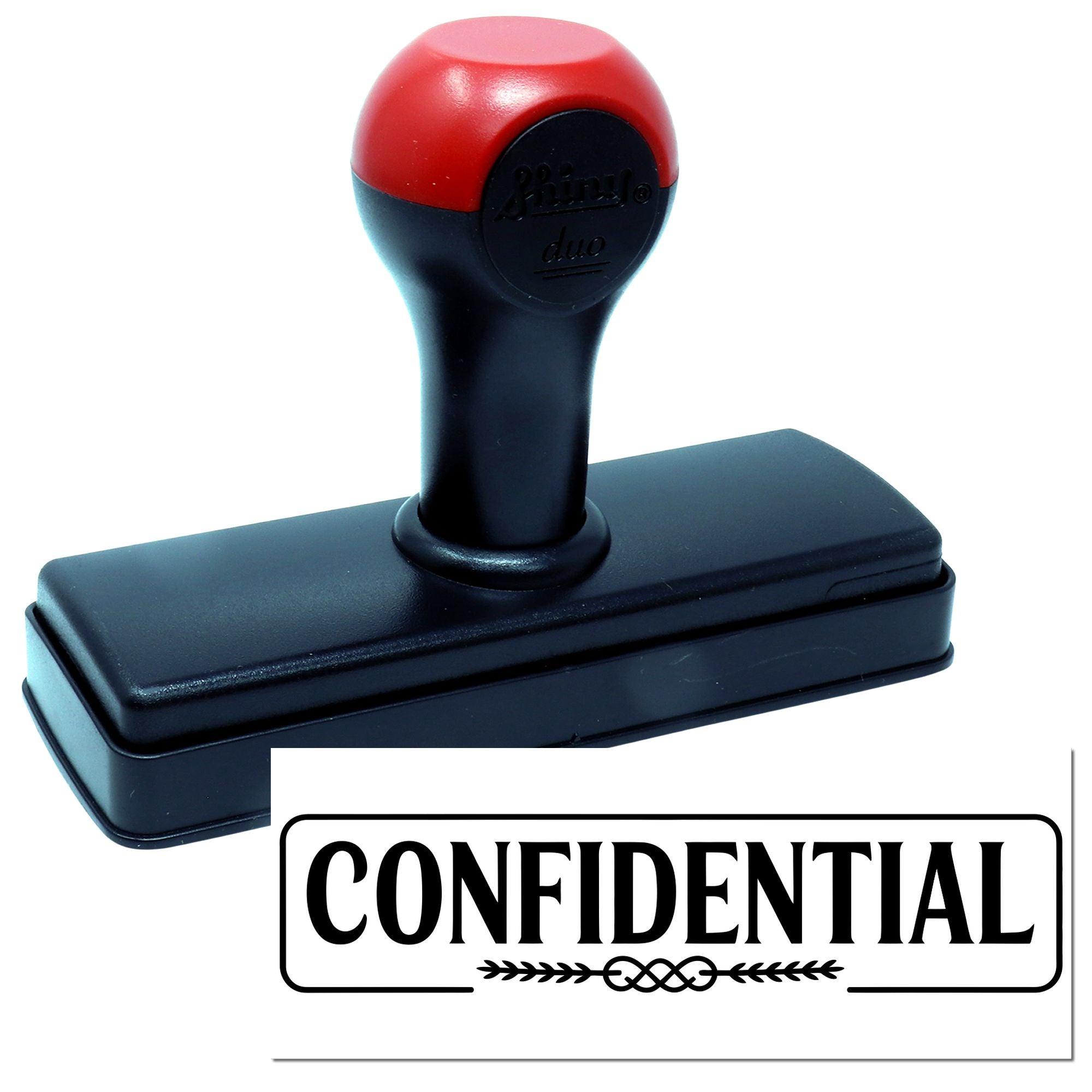 Red and black self-inking confidential stamp with rectangular black base and bold CONFIDENTIAL seal impression.