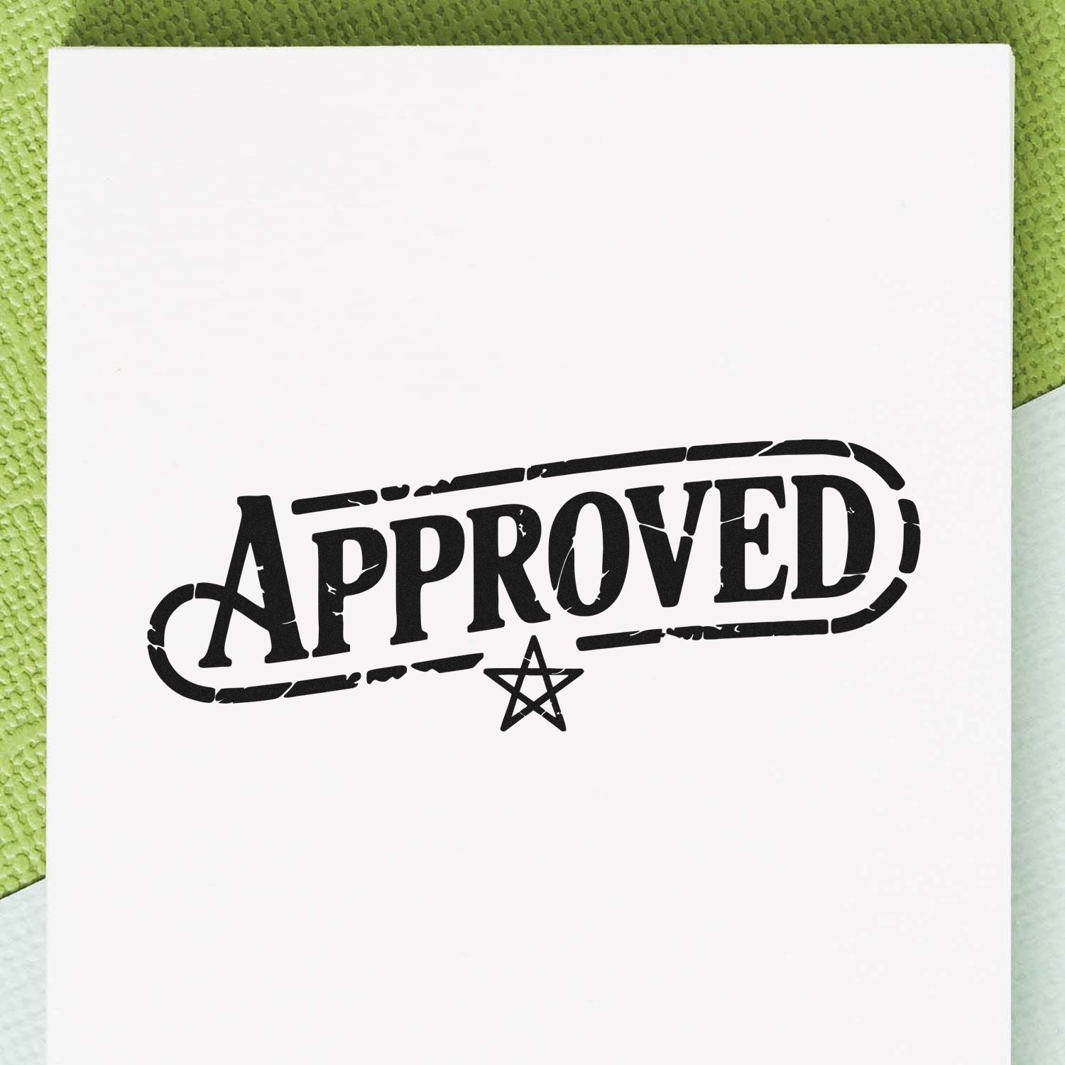 Black APPROVED rubber stamp with star seal on white paper, set against a green textured background.