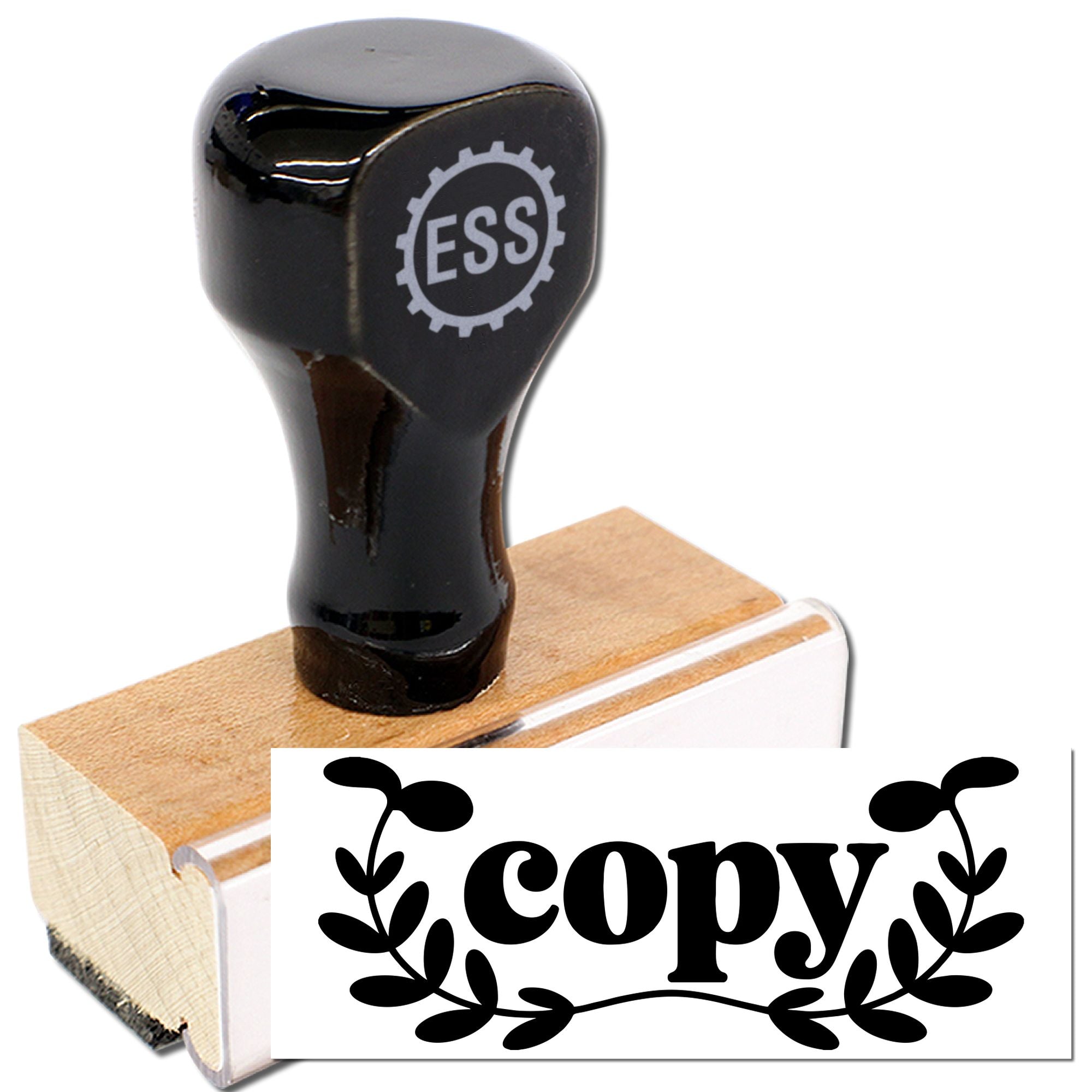 Black ESS rubber stamp and seal on a natural wood block with a white copy label and black floral design.