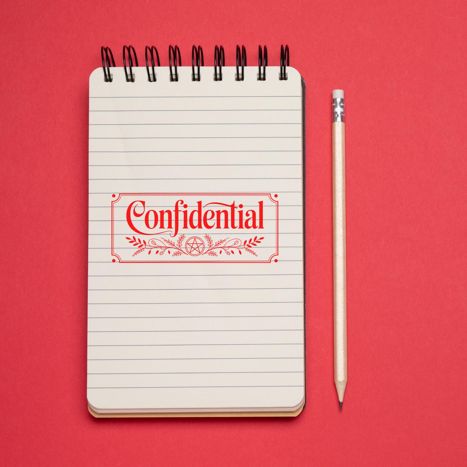 Notepad with red Confidential seal stamp on lined pages, beside a pencil, against a bright red background.