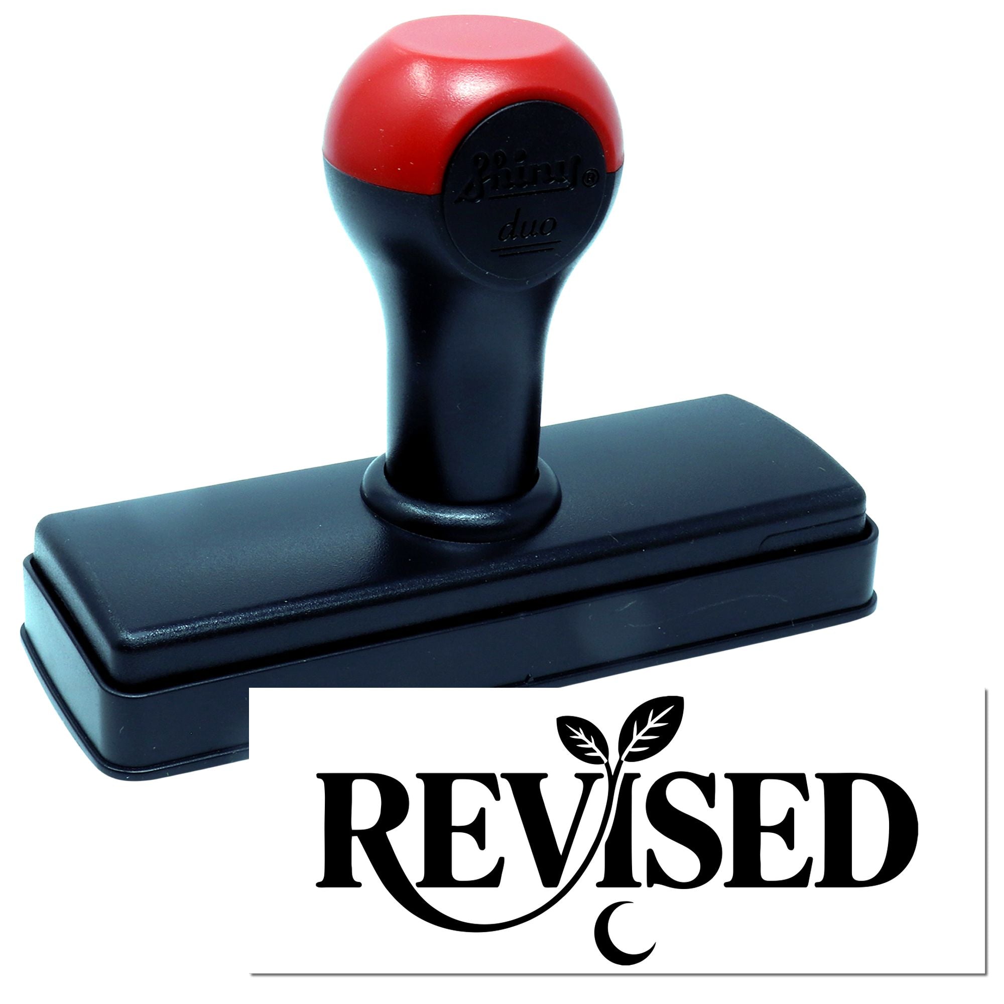 Red-and-black self-inking stamp and seal with REVISED imprint on a white card.