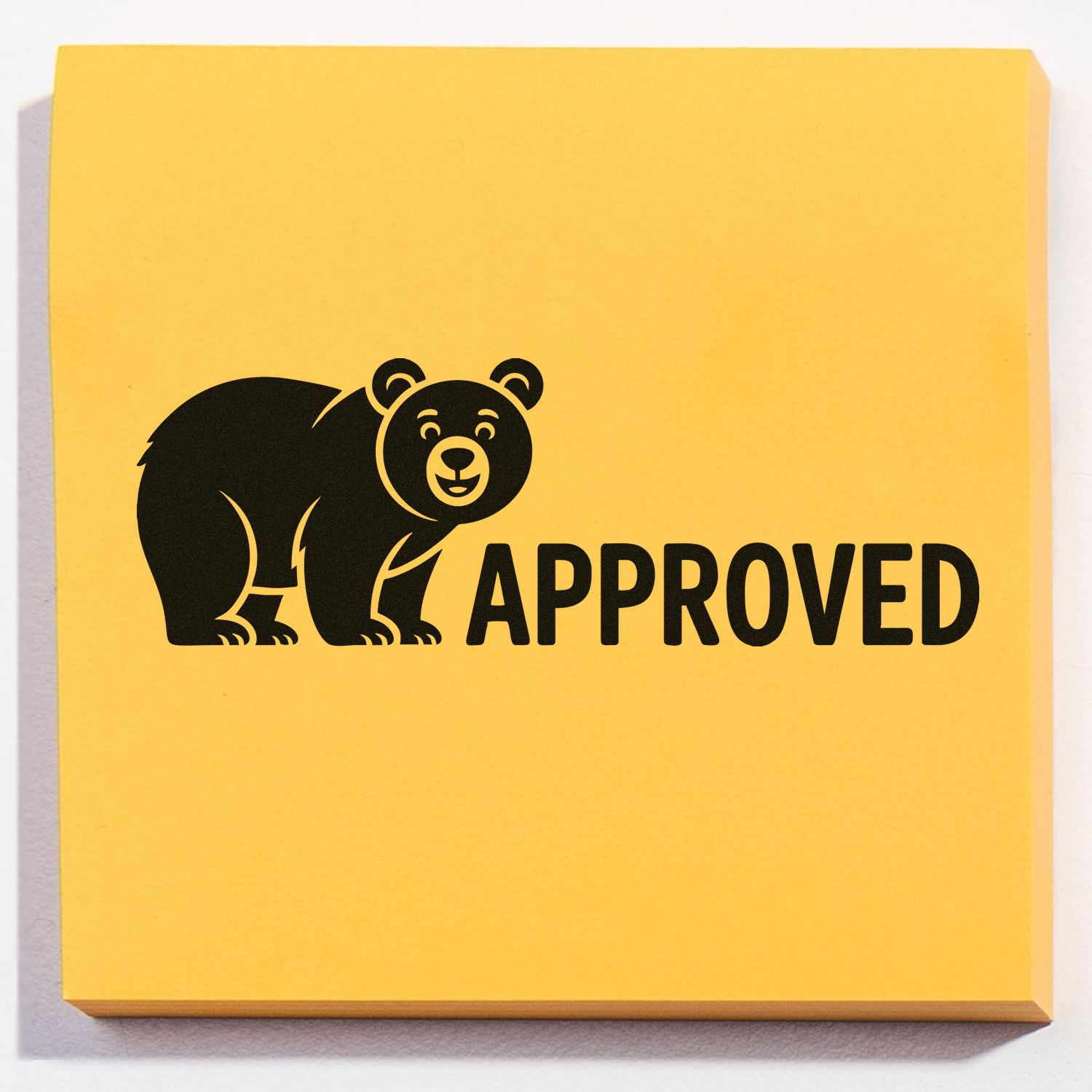 Yellow approved stamp seal with black bear graphic and bold APPROVED text on a yellow block.