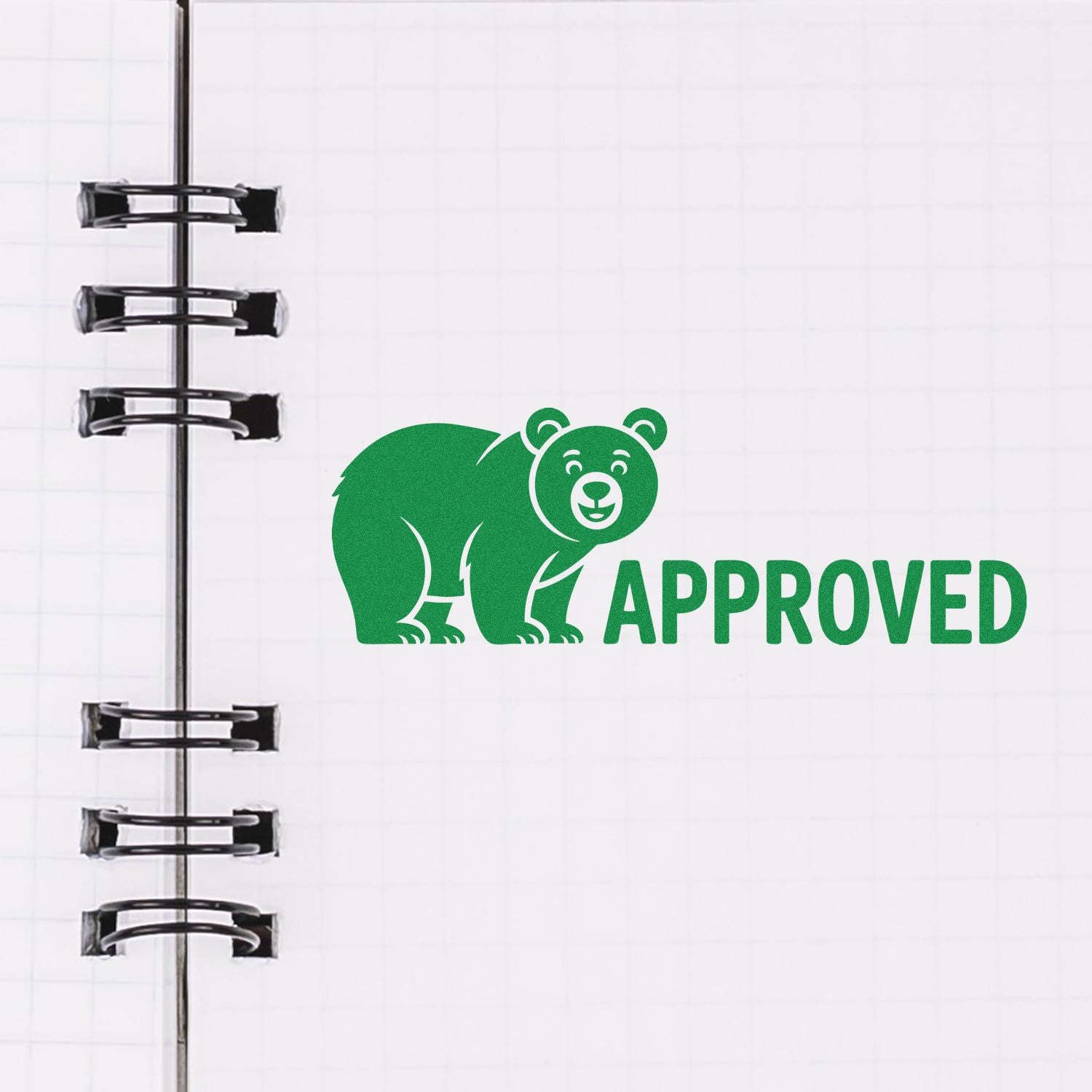 Green bear APPROVED stamp and seal design on notebook paper with black binder rings.